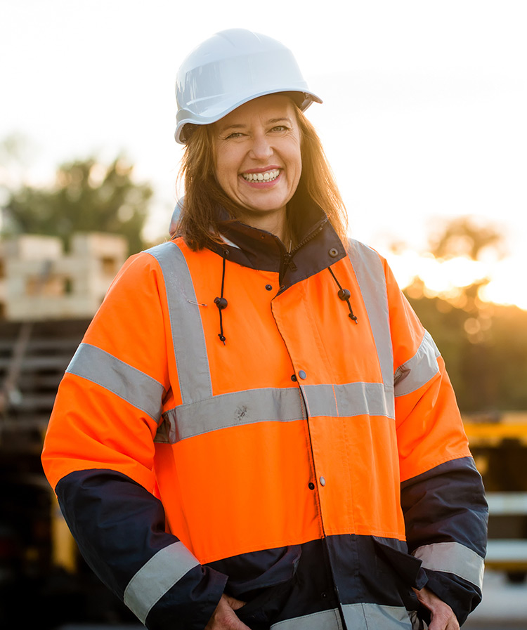 A smiling female construction worker